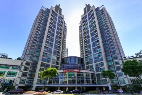 Twin residential towers and entrance driveway of Ascott Residences in Makati City