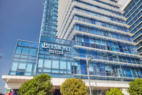 Glass façade and signage of Belmont Hotel Mactan