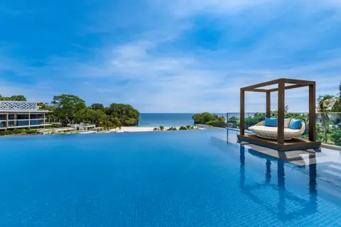 Infinity pool and cabana overlooking the sea at Crimson Boracay Resort