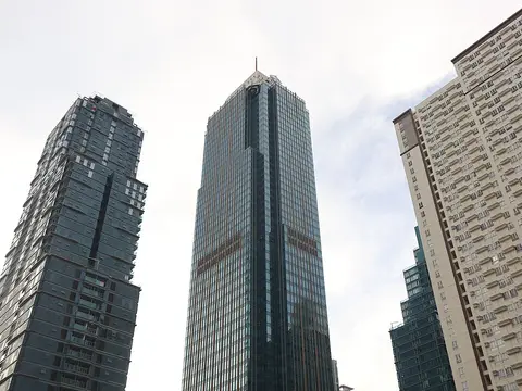 Glass curtain-wall towers of Metrobank Center and Grand Hyatt Manila rising over Bonifacio Global City