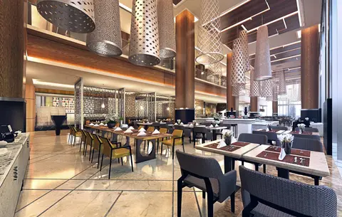 Restaurant interior with perforated metal pendant lights at Sheraton Mactan